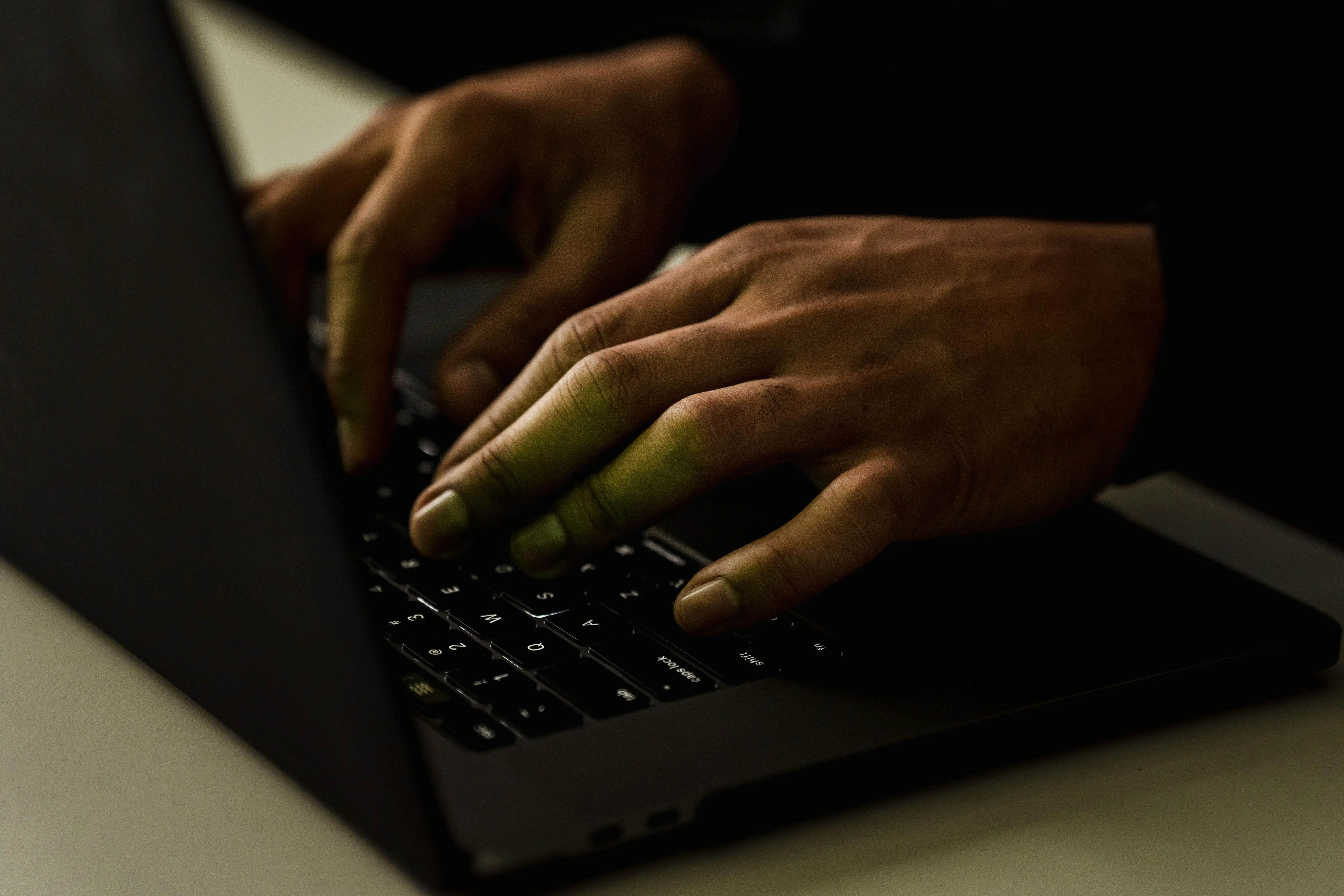 Person typing on laptop